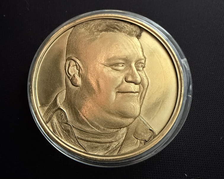 Brass coin with bas-relief laser engraving